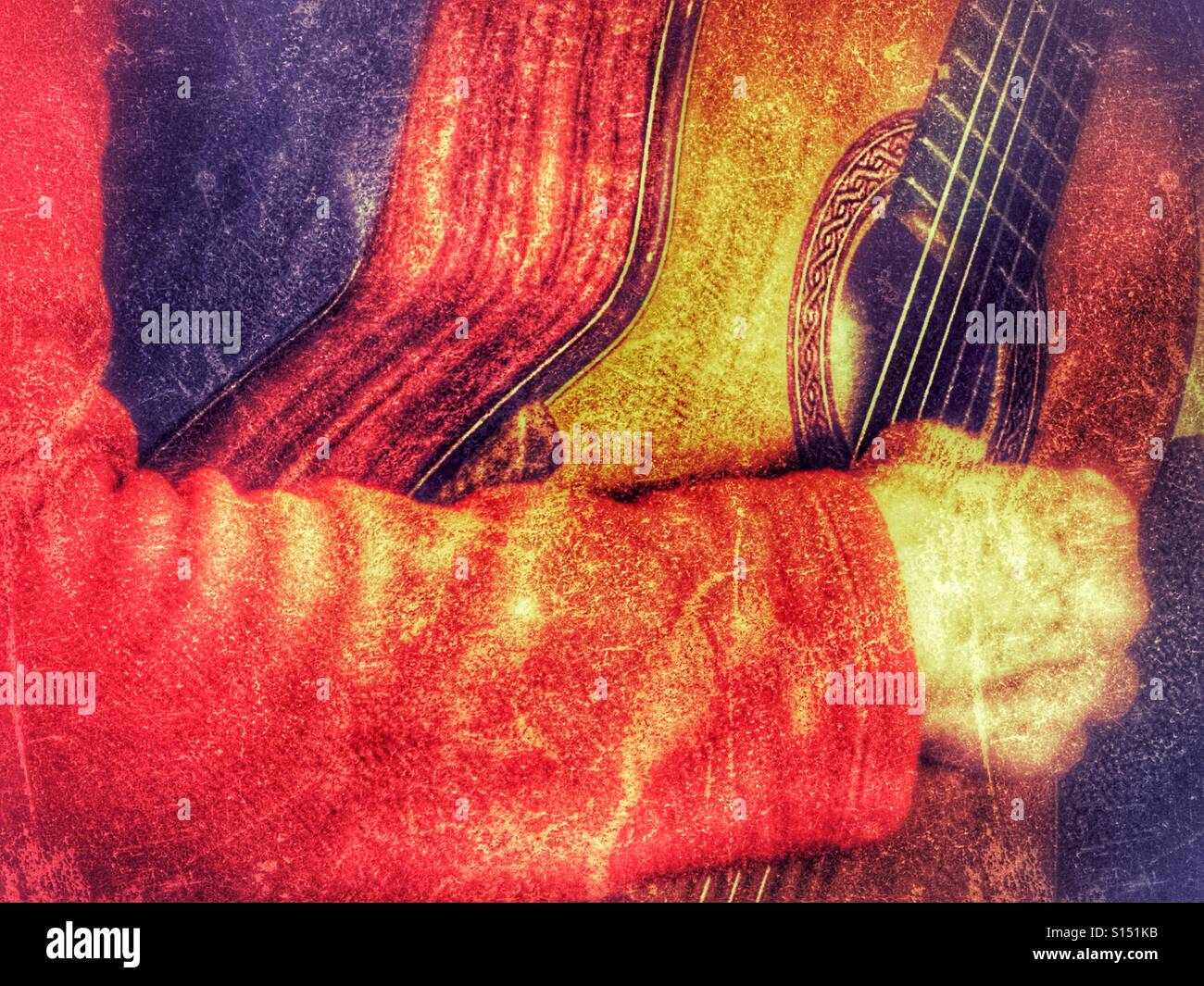 Woman playing a classical guitar made by Greg Smallman &Sons. Close up,  hand on strings, showing rosette - Smartphone Captured Stock Image