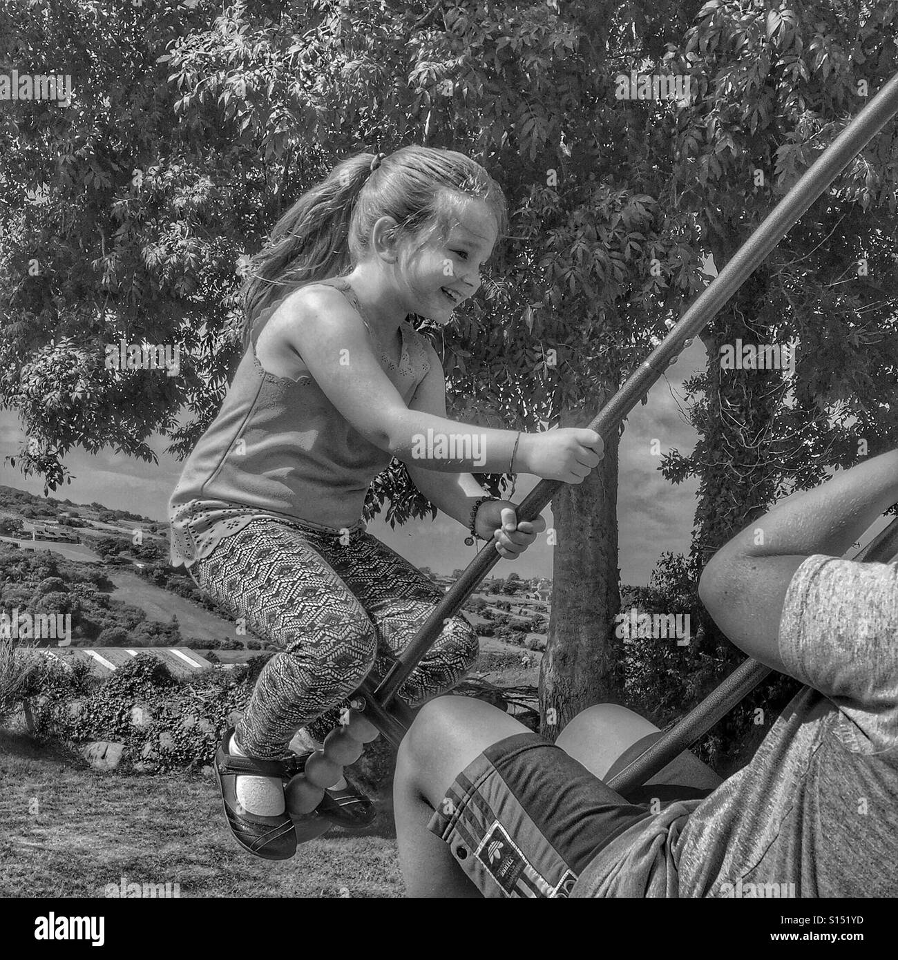 Young girl on swing Stock Photo