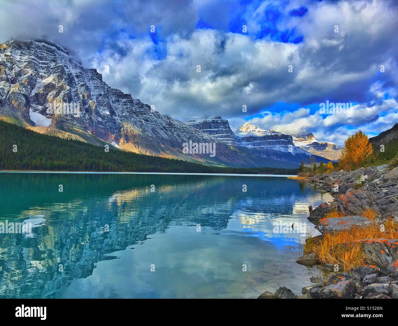 Cloudy day at Waterfowl Lake and the Canadian Rocky Mountains and Autumn colours - Smartphone Captured Stock Image