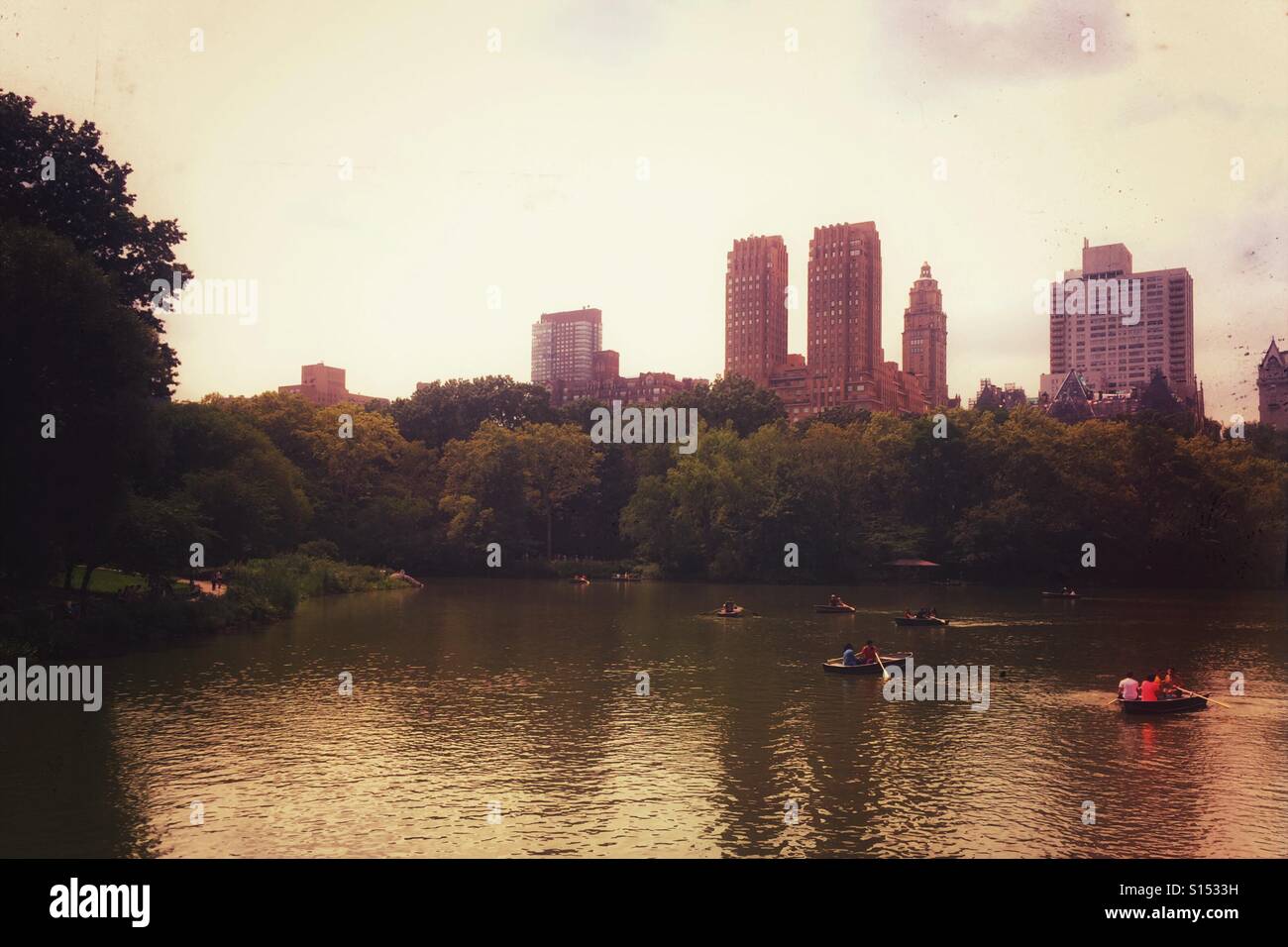 Central Park, view of lake and buildings in the background. Manhattan, New York - Smartphone Captured Stock Image