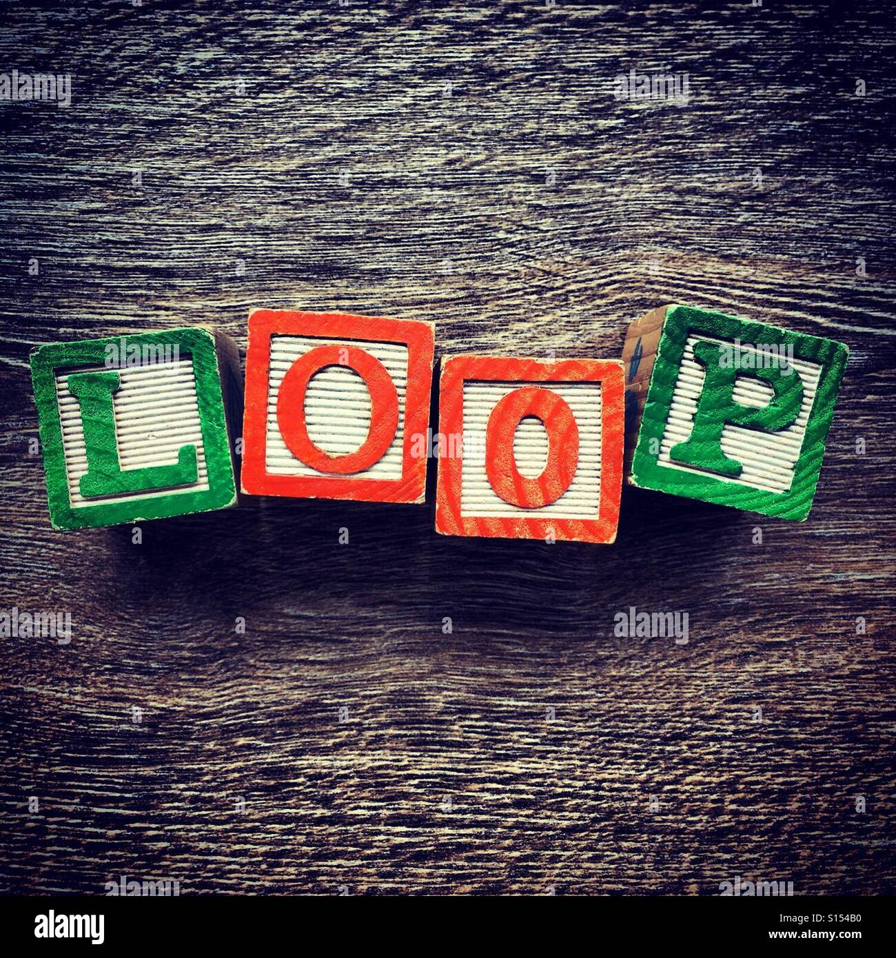 LOOP word written with alphabet wood block letter toys Stock Photo - Alamy