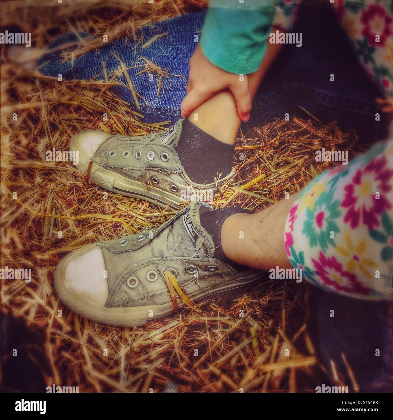 A girl's feet on a hayride. Stock Photo