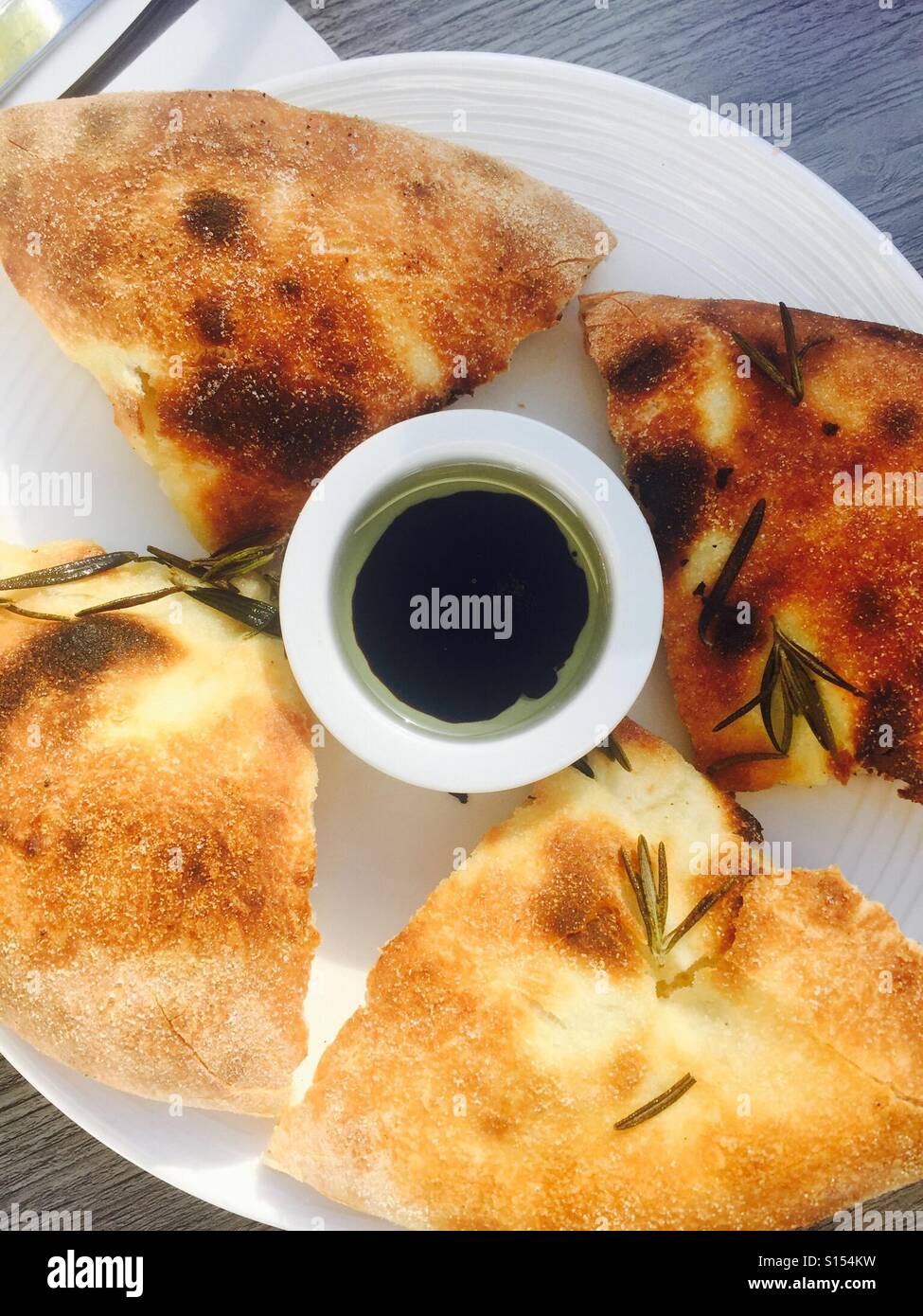 Focaccia bread with oil dip Stock Photo Alamy