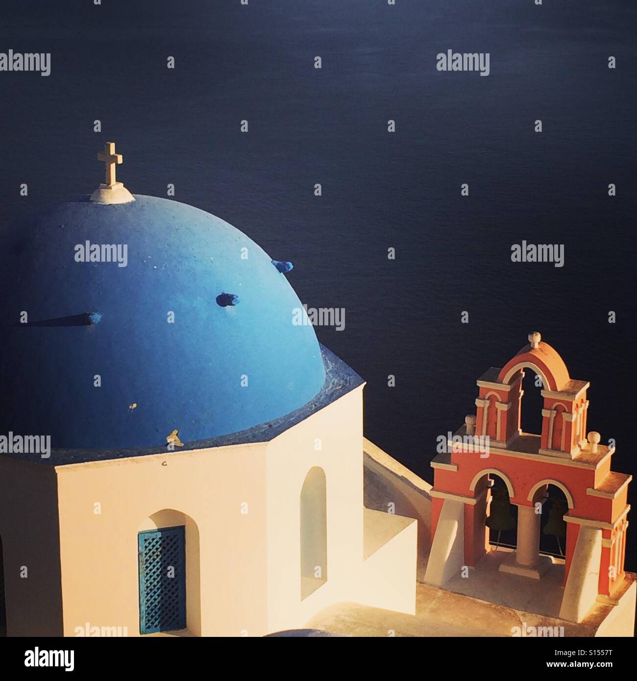 One of the famous blue domes in the village of Oia, Santorini, Greece - Smartphone Captured Stock Image