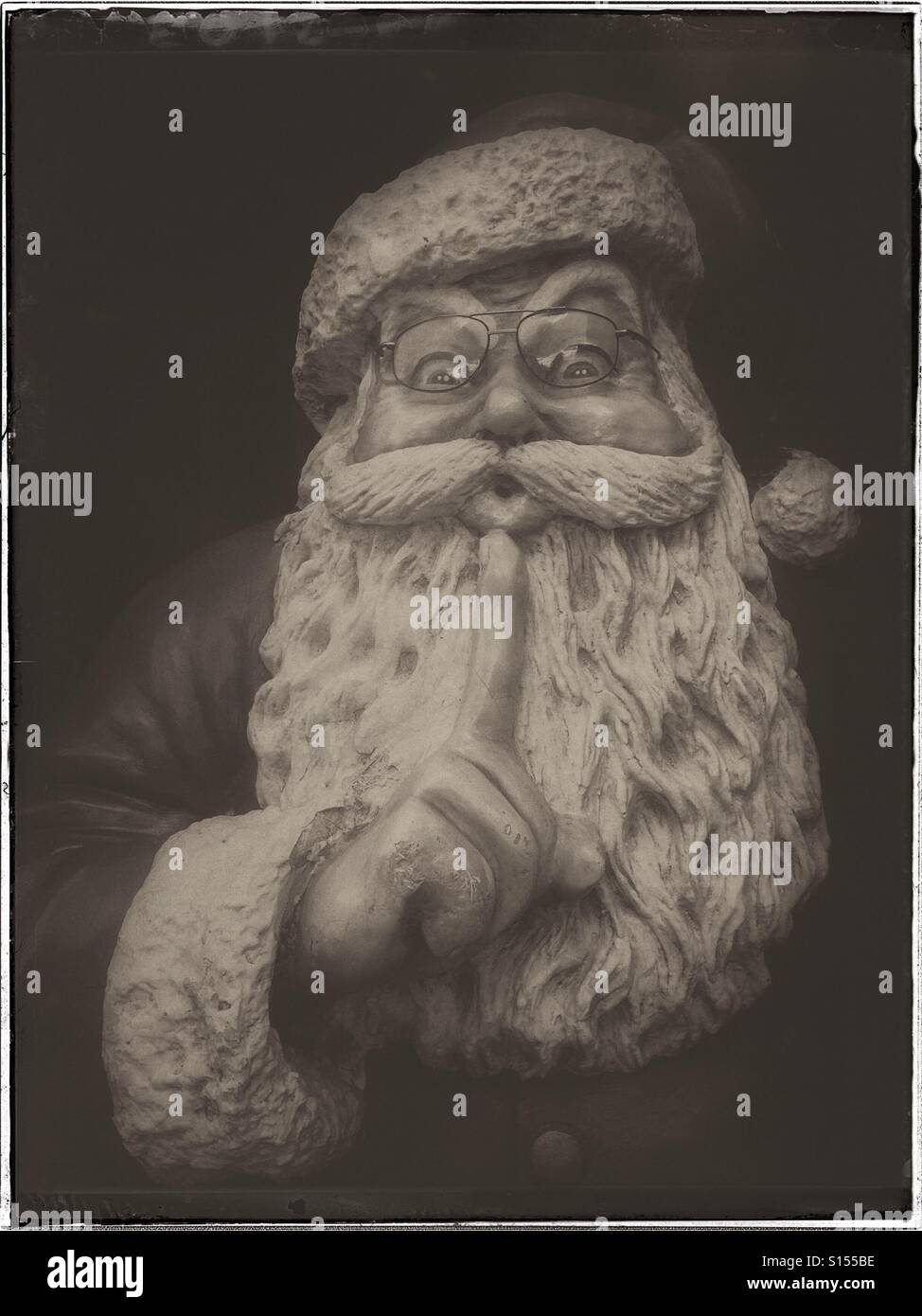 A portrait of Santa Claus. Every 25th December this person visits every child's home and leaves lots of presents. Santa then flies away on his sleigh with Rudolph the Red Nosed Reindeer. © C.HOSKINS. - Smartphone Captured Stock Image