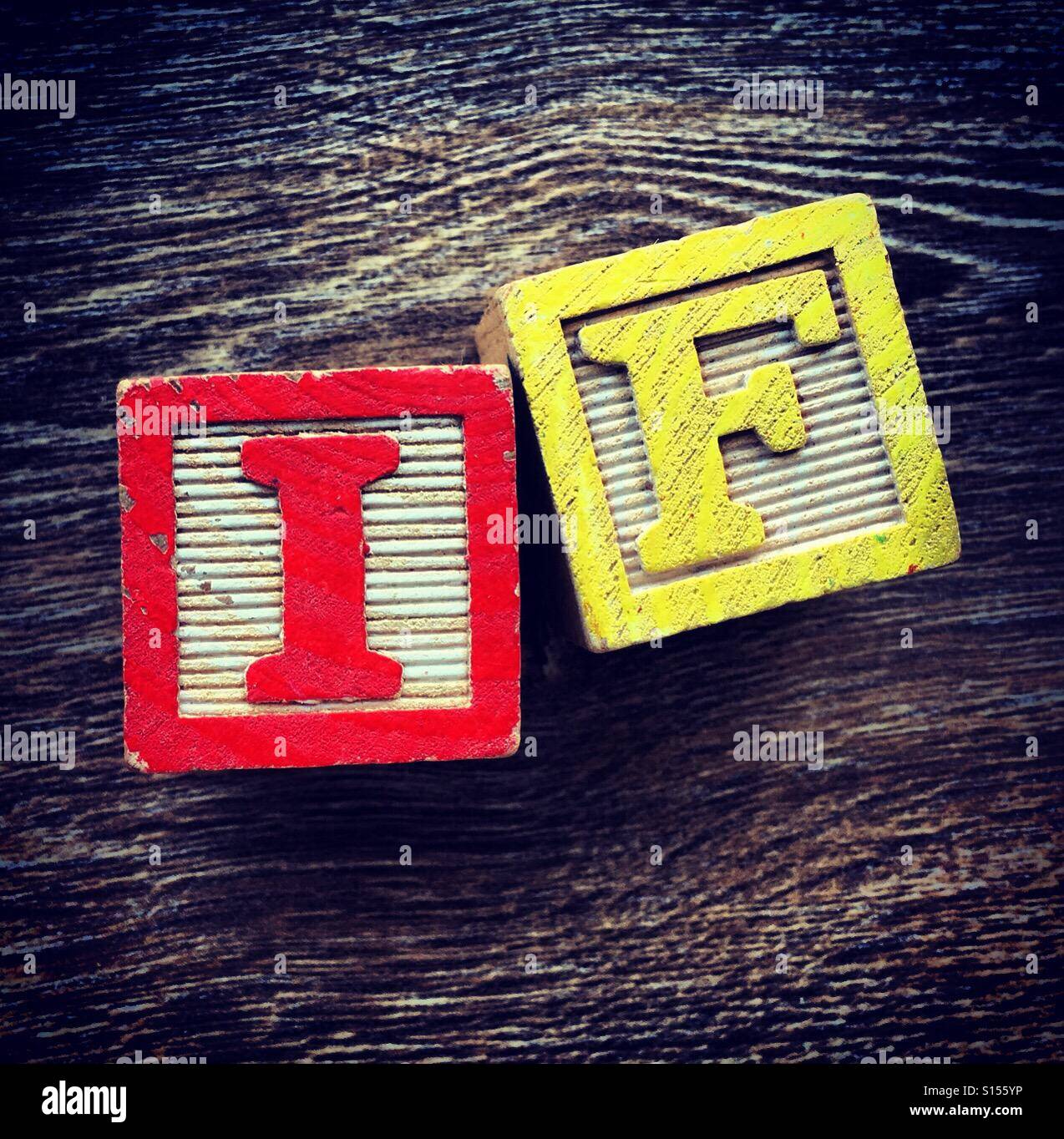 IF word written with wood block letter toys - Smartphone Captured Stock Image