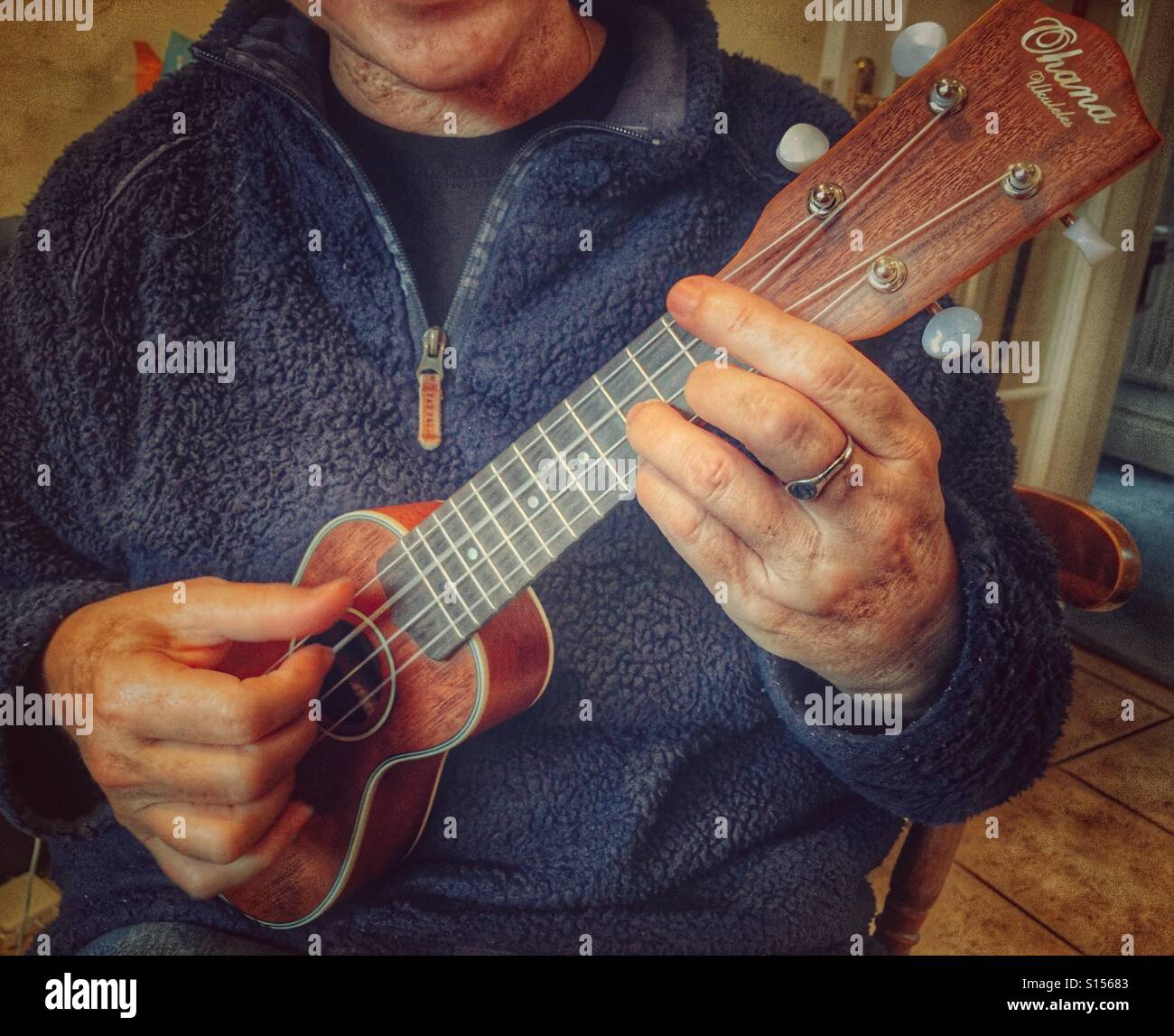 Woman playing an Ohana O Nino Sopranissimo ukulele Stock Photo Alamy