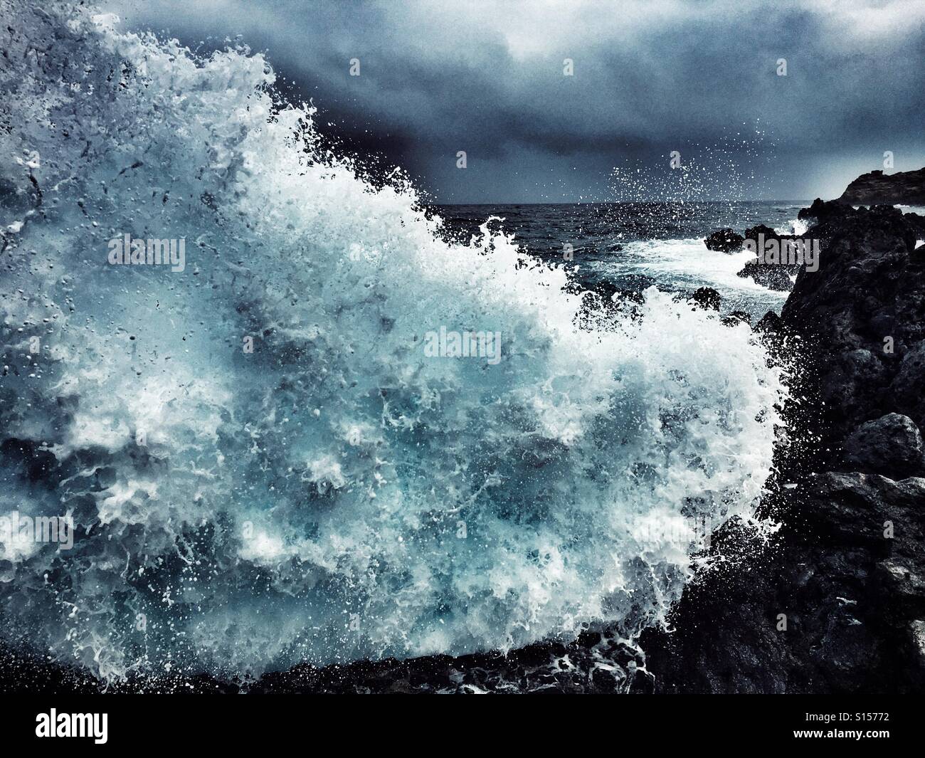 Crashing waves and dramatic skies Stock Photo