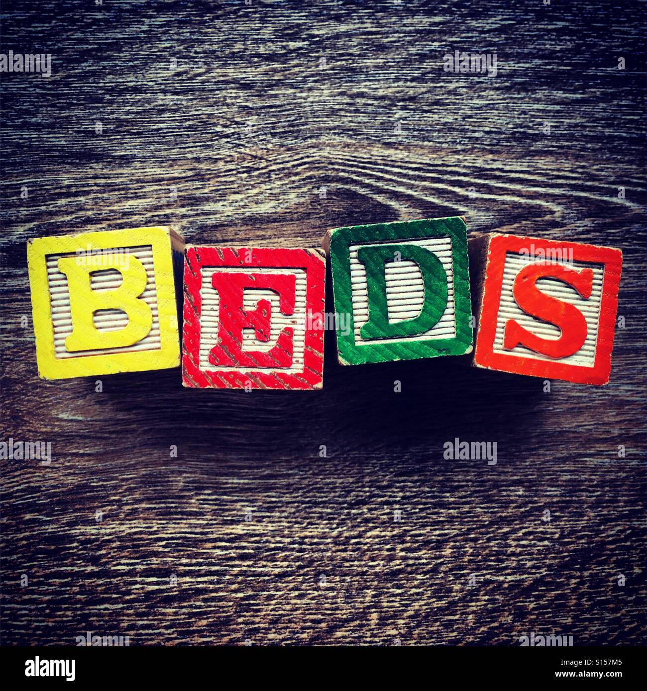 BEDS word written with wood block letter toys Stock Photo Alamy
