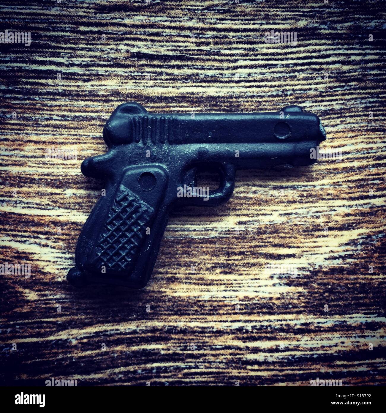 Tiny Plastic gun toy - Smartphone Captured Stock Image