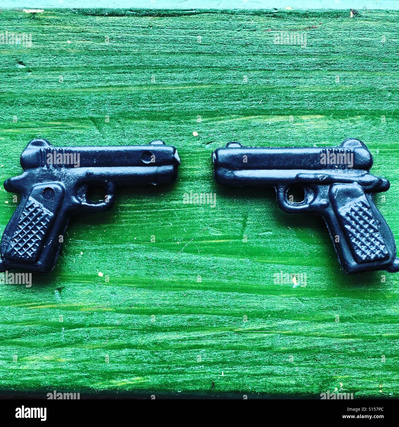 Face to face guns - Smartphone Captured Stock Image