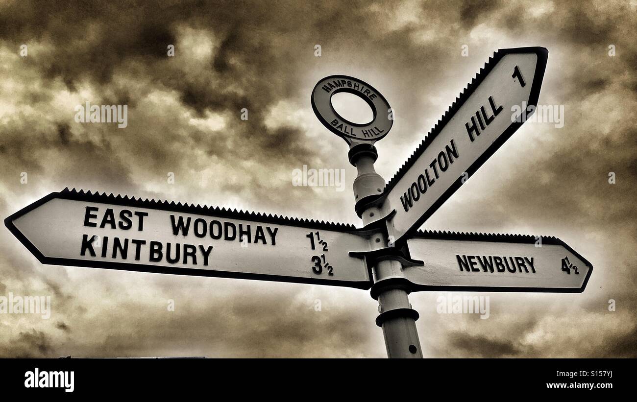 Road sign with three directions to local villages and town, Newbury and surroundings Stock Photo