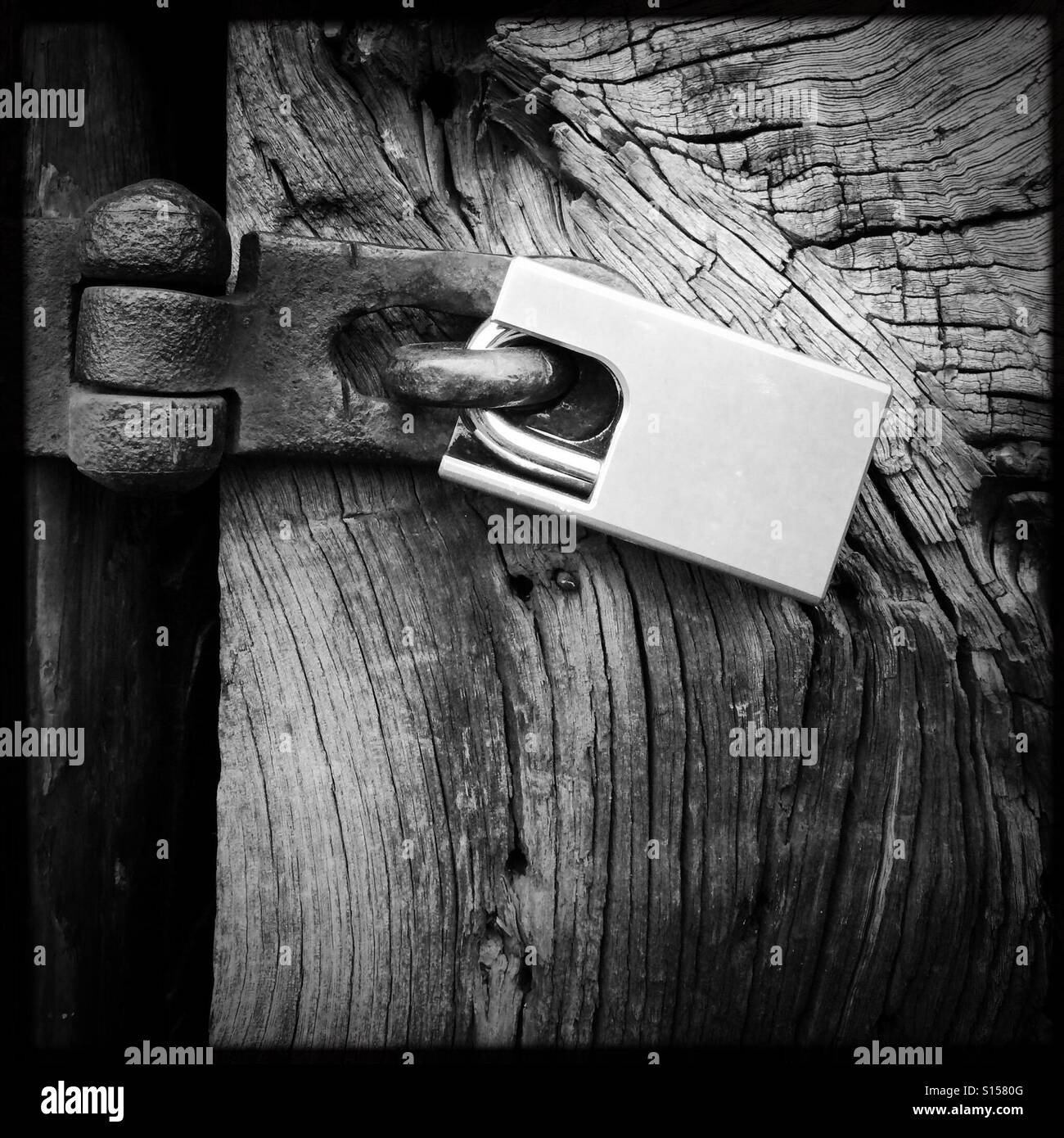 New lock on an old door Stock Photo