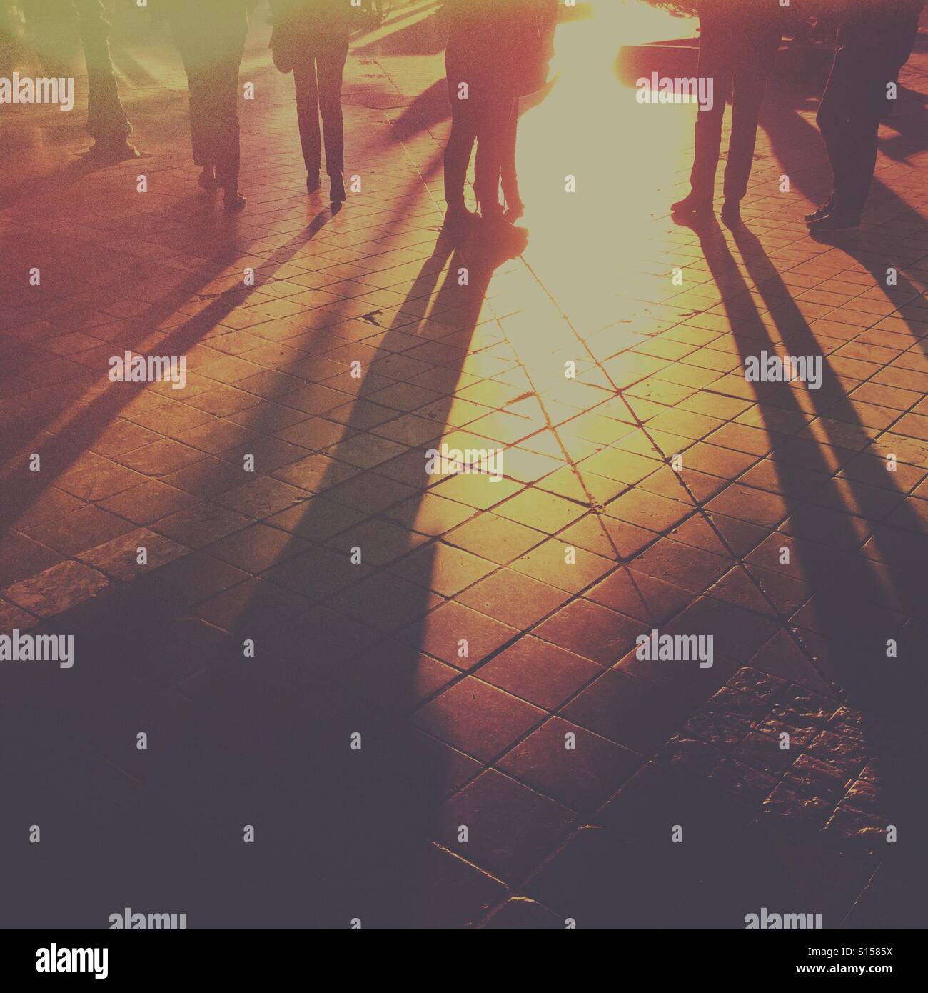 Silhouettes of people standing in a street - Smartphone Captured Stock Image