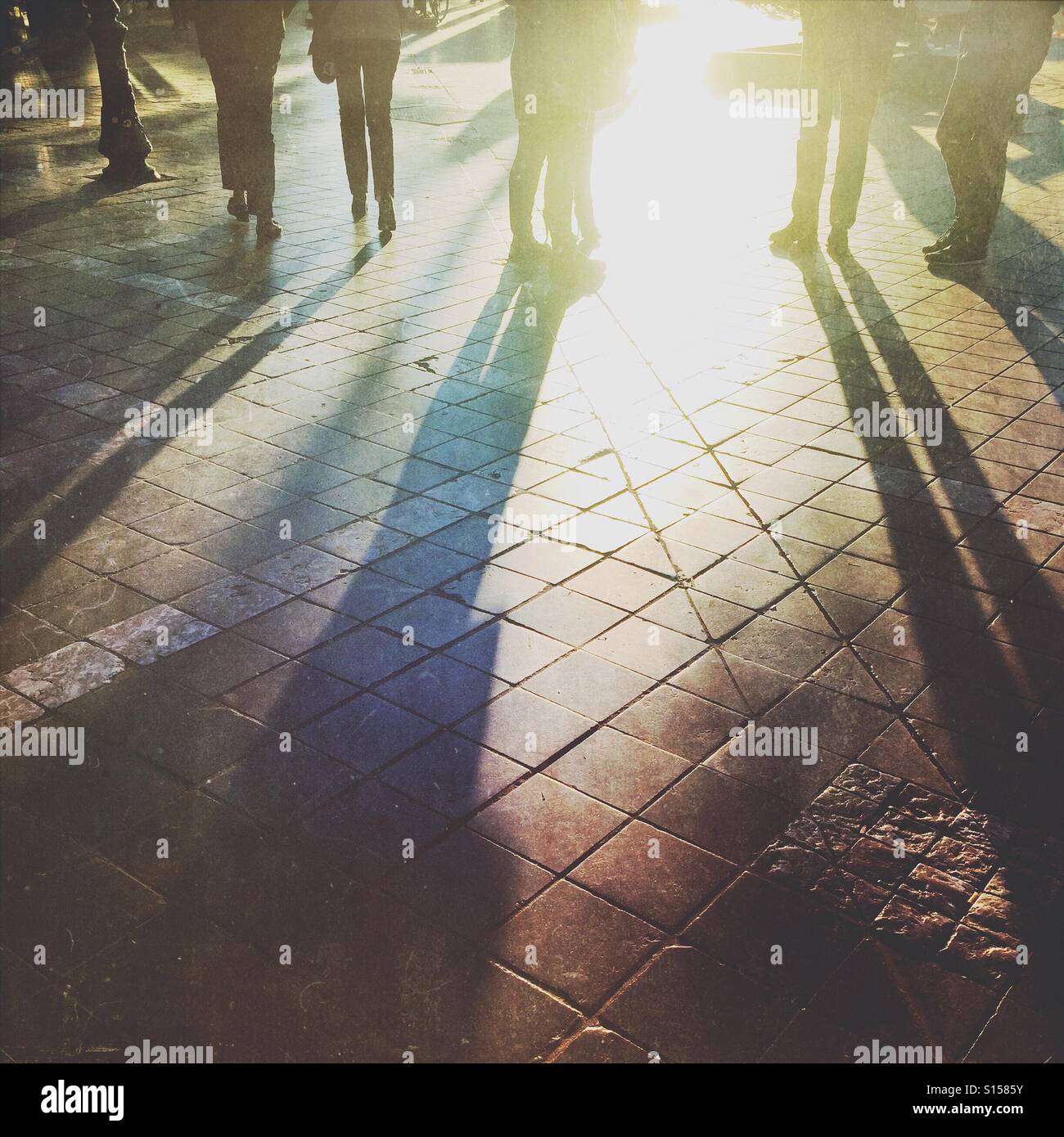 Silhouettes of people standing in a street - Smartphone Captured Stock Image