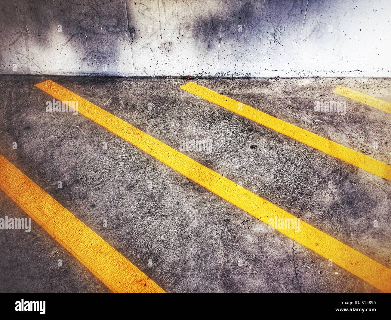 No parking zone stripes in a concrete parkade. Stock Photo