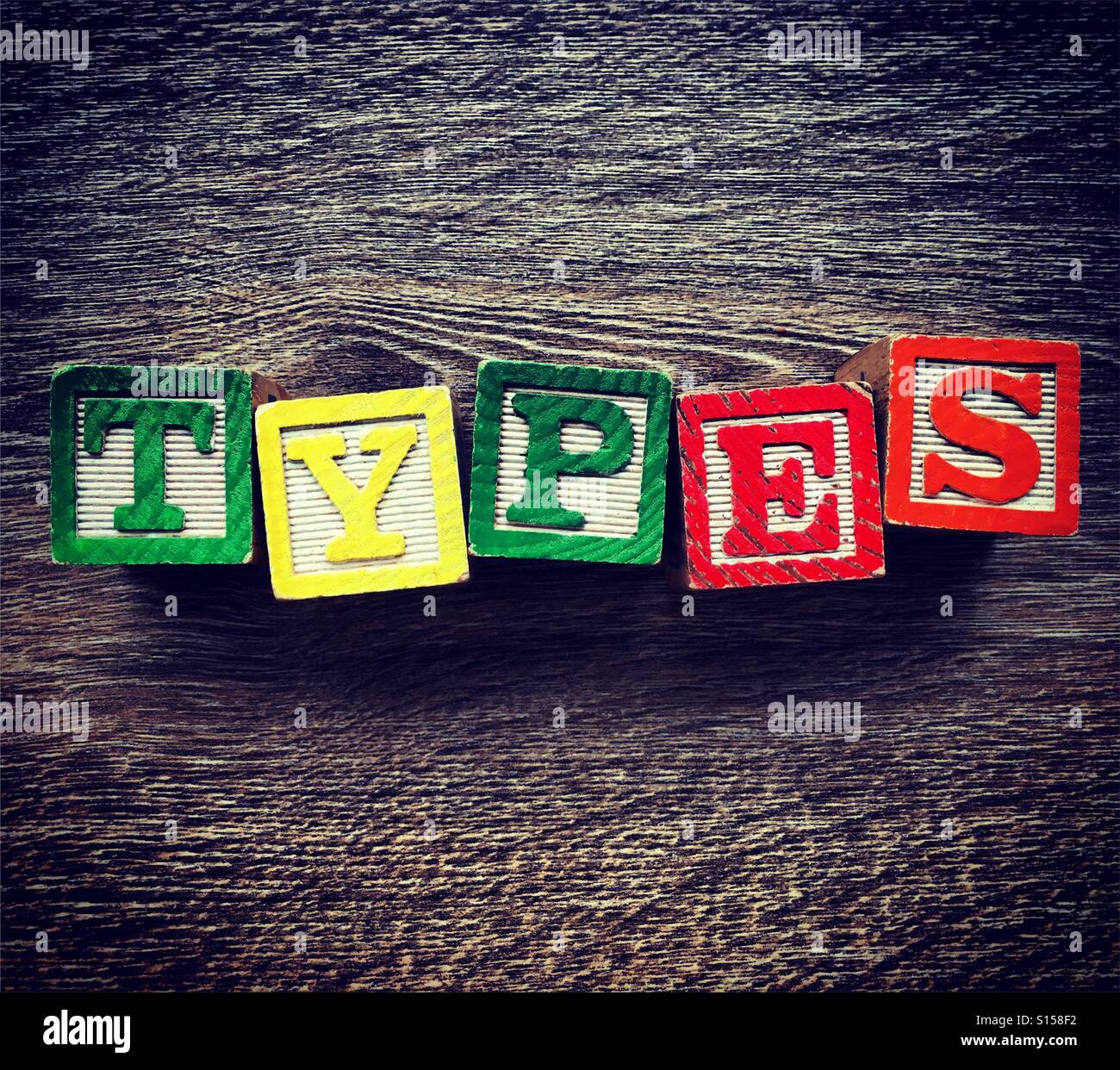 TYPES word written with wood block letter toys - Smartphone Captured Stock Image