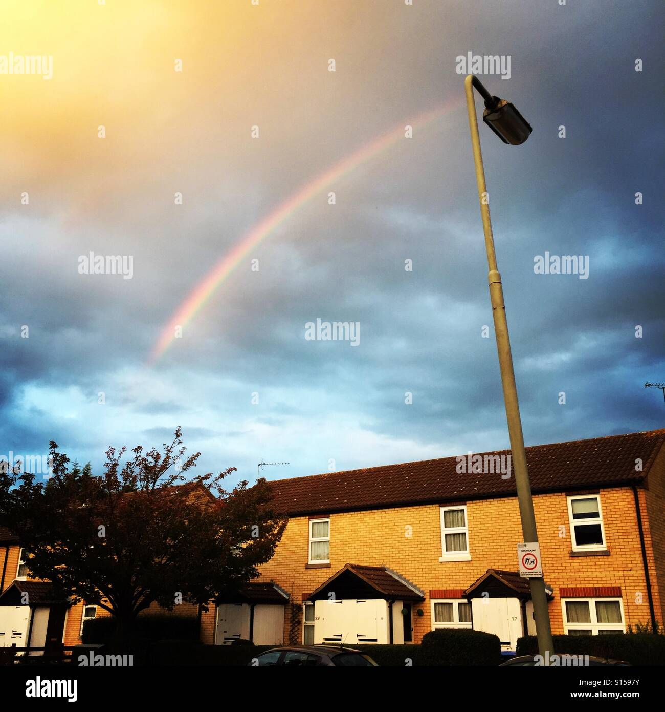 Rainbow over suburbia - Smartphone Captured Stock Image