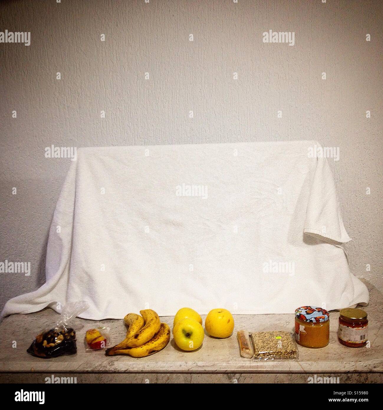 A towell covering a tv and organic fruits and honey in a hotel in Puebla de Zaragoza, Mexico Stock Photo