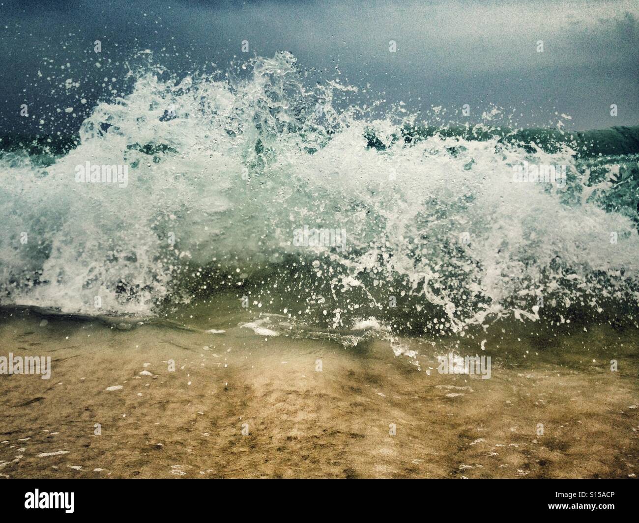Dramatic skies and crashing waves - Smartphone Captured Stock Image
