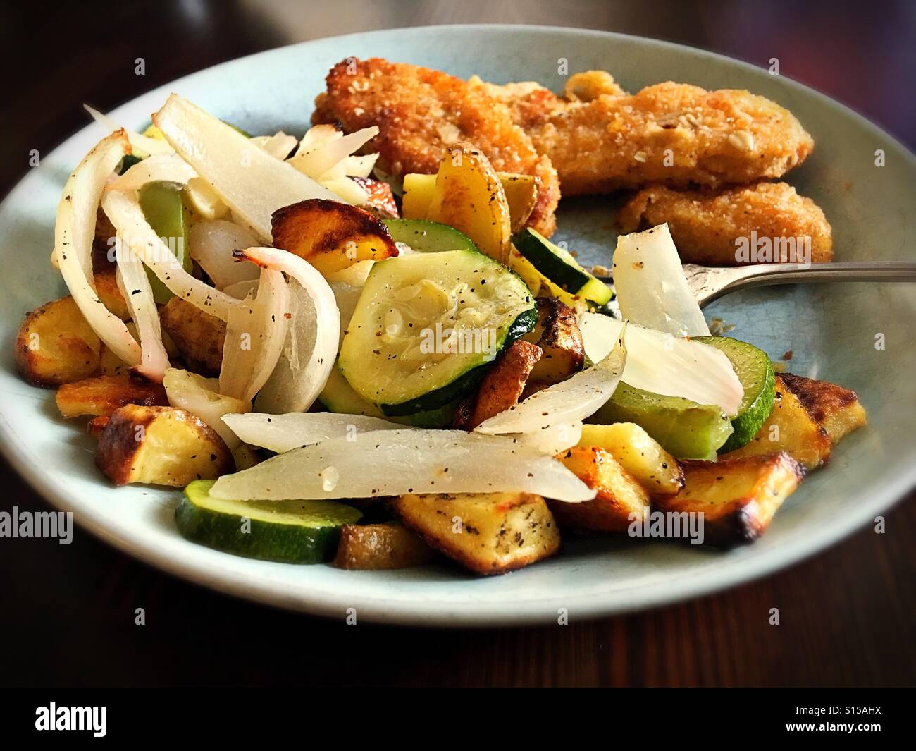 A vegan meal of roasted vegetables and meat free tenders. Stock Photo