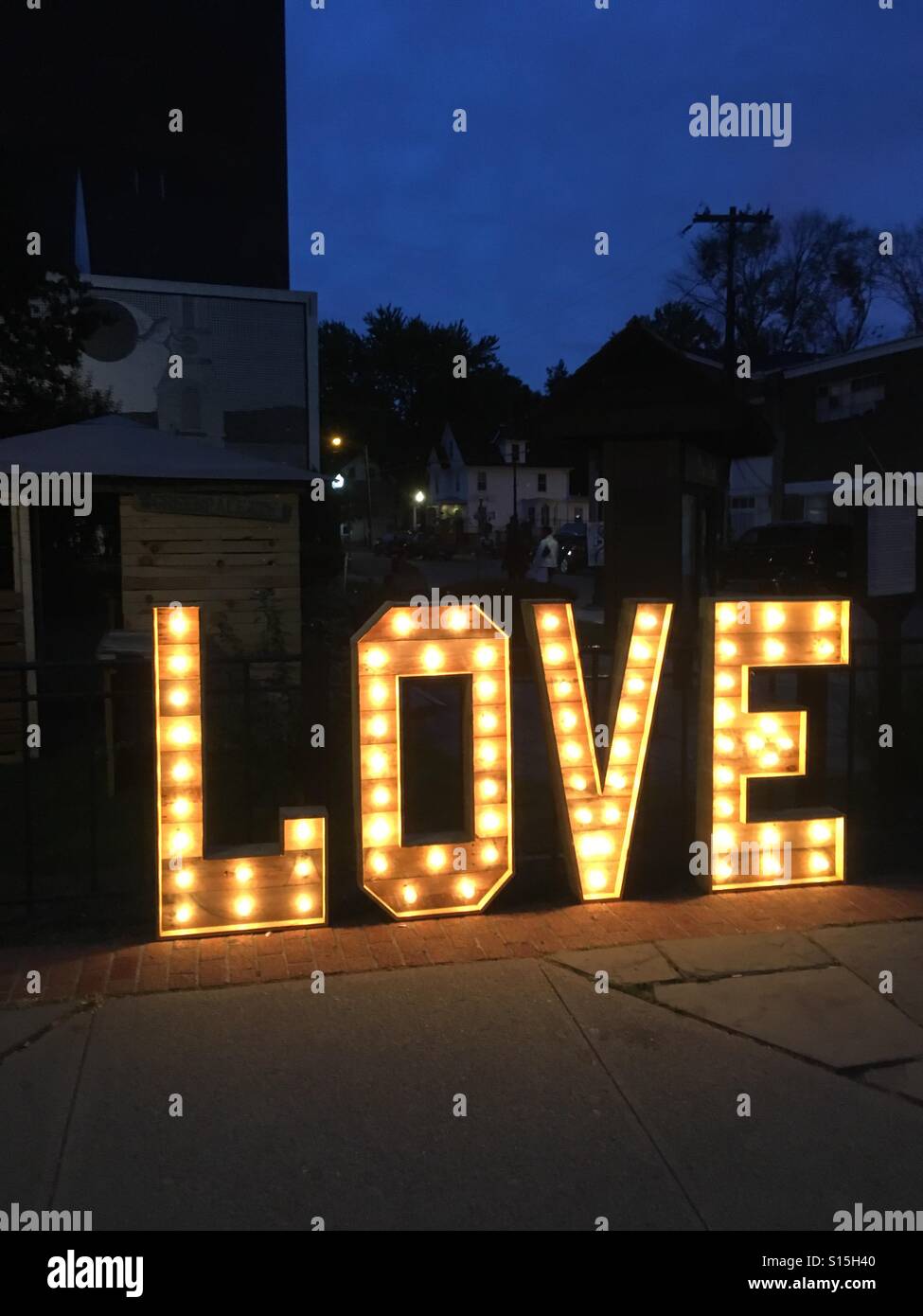 Sign that lights up with the word love - Smartphone Captured Stock Image