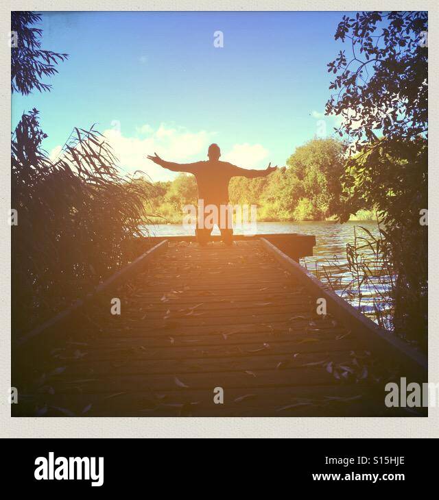 Man on knees praying hi-res stock photography and images - Alamy