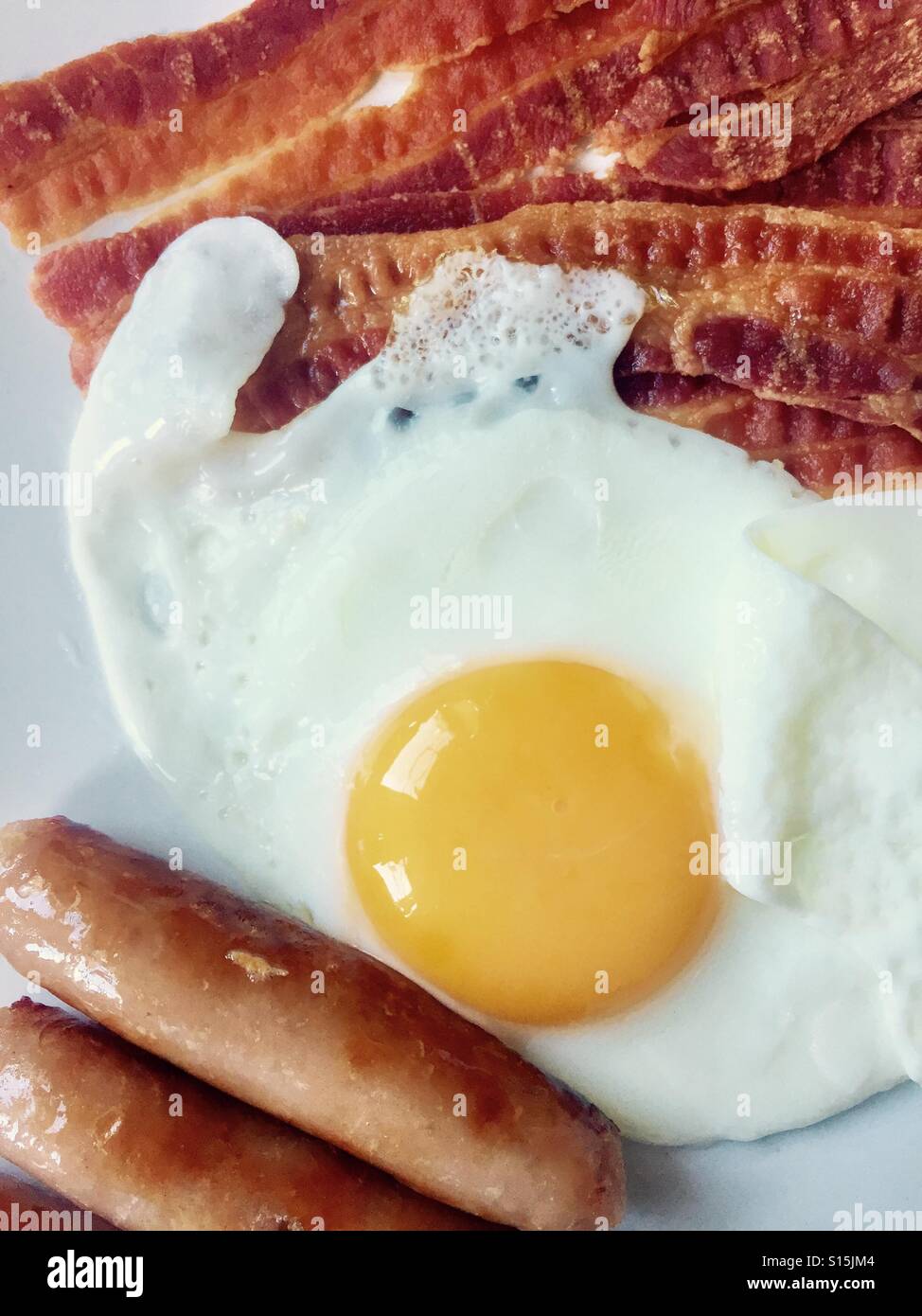 Fried egg, bacon and sausage breakfast Stock Photo Alamy