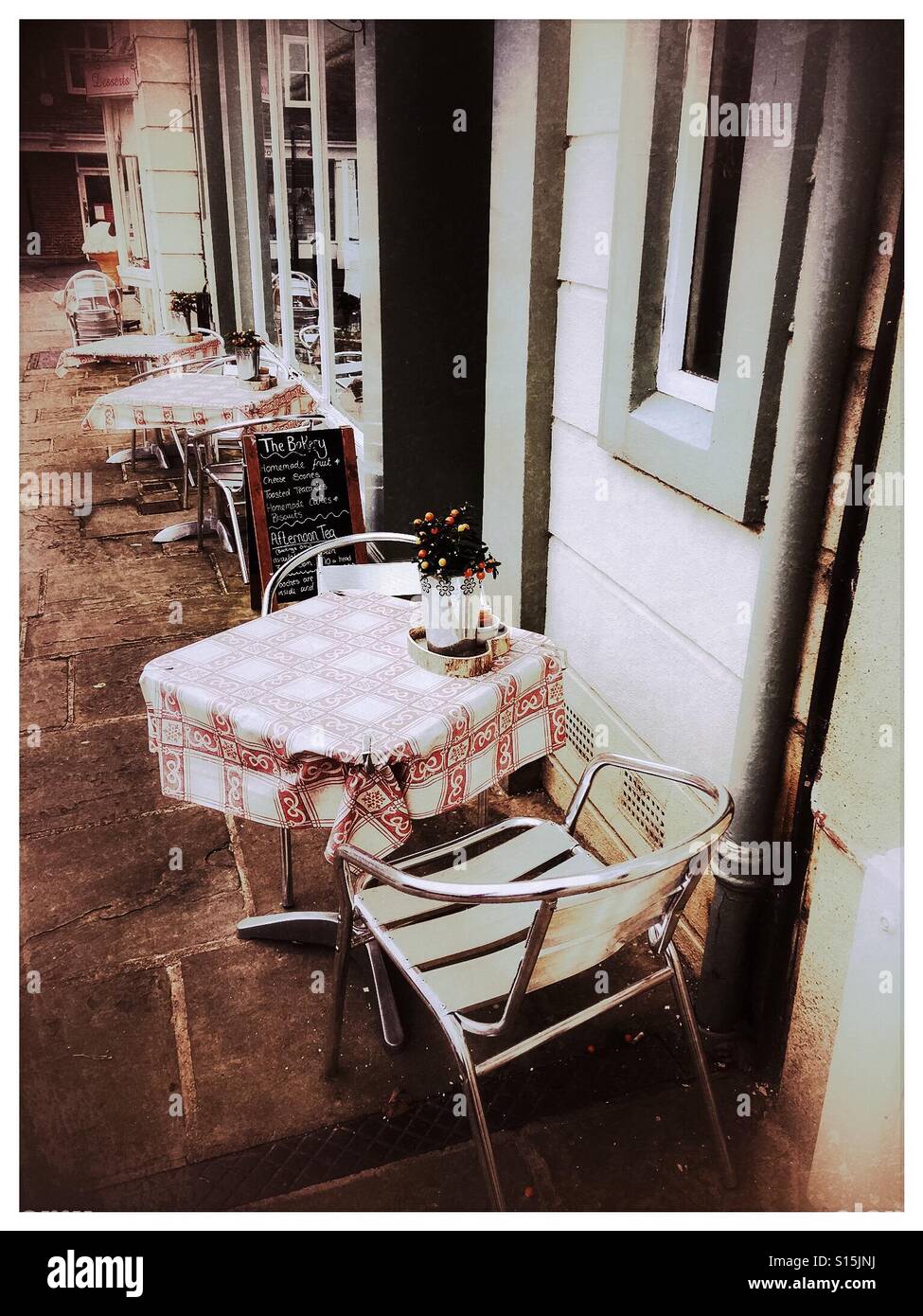 Cafe culture, outdoor tables for two, unoccupied - Smartphone Captured Stock Image