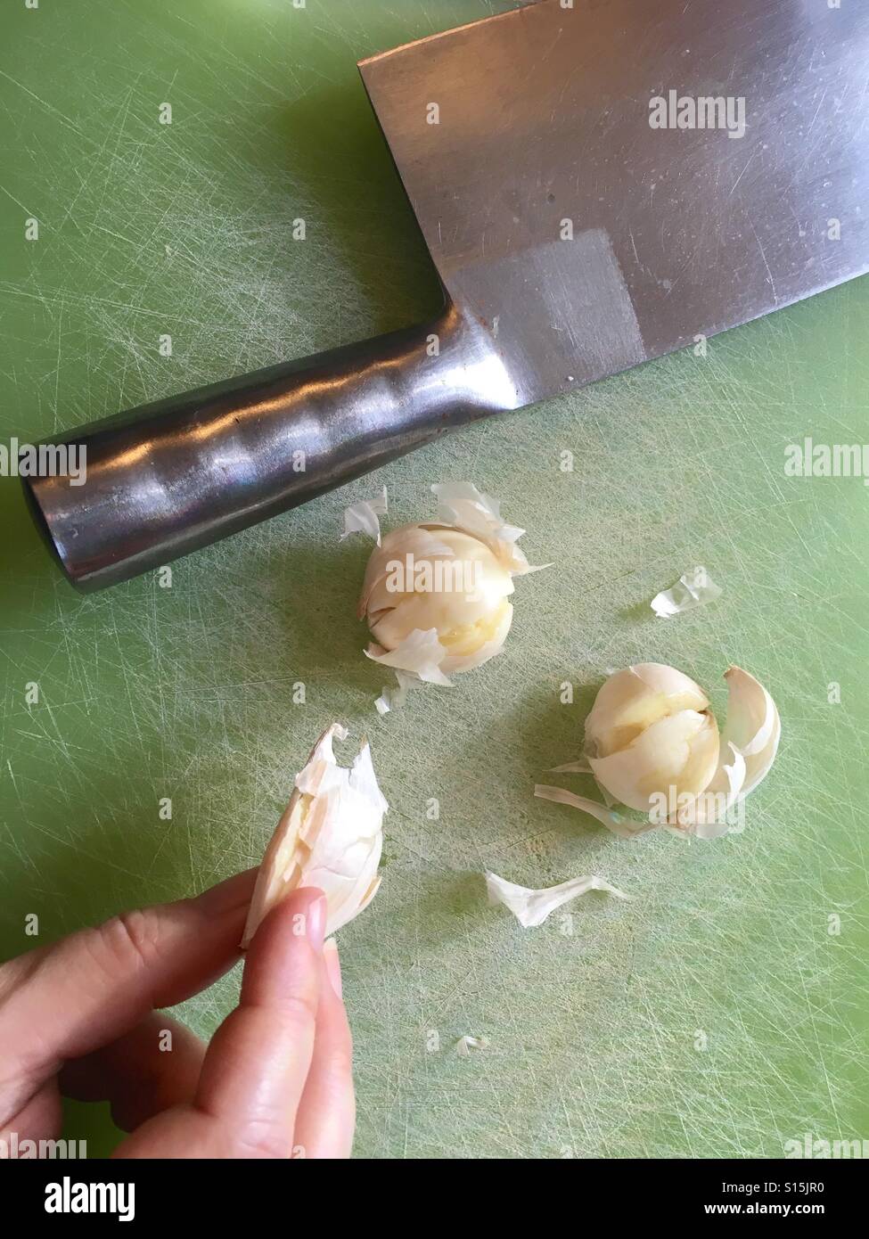 Peeling garlic Stock Photo