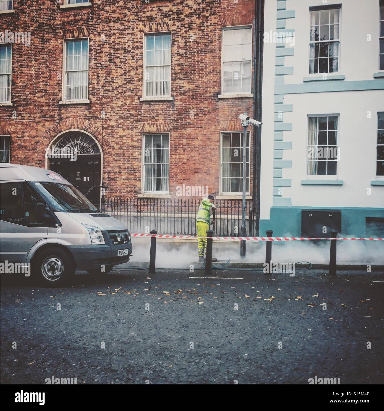 The Bubblegum Man removing chewing gum off the streets in the city. Stock Photo