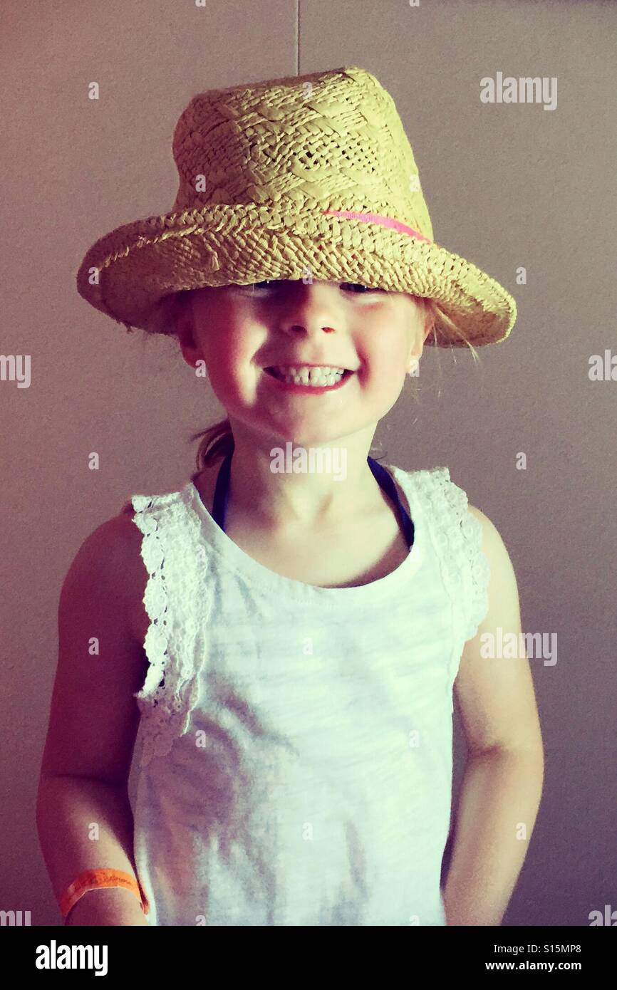 Young girl wearing hat and smiling Stock Photo