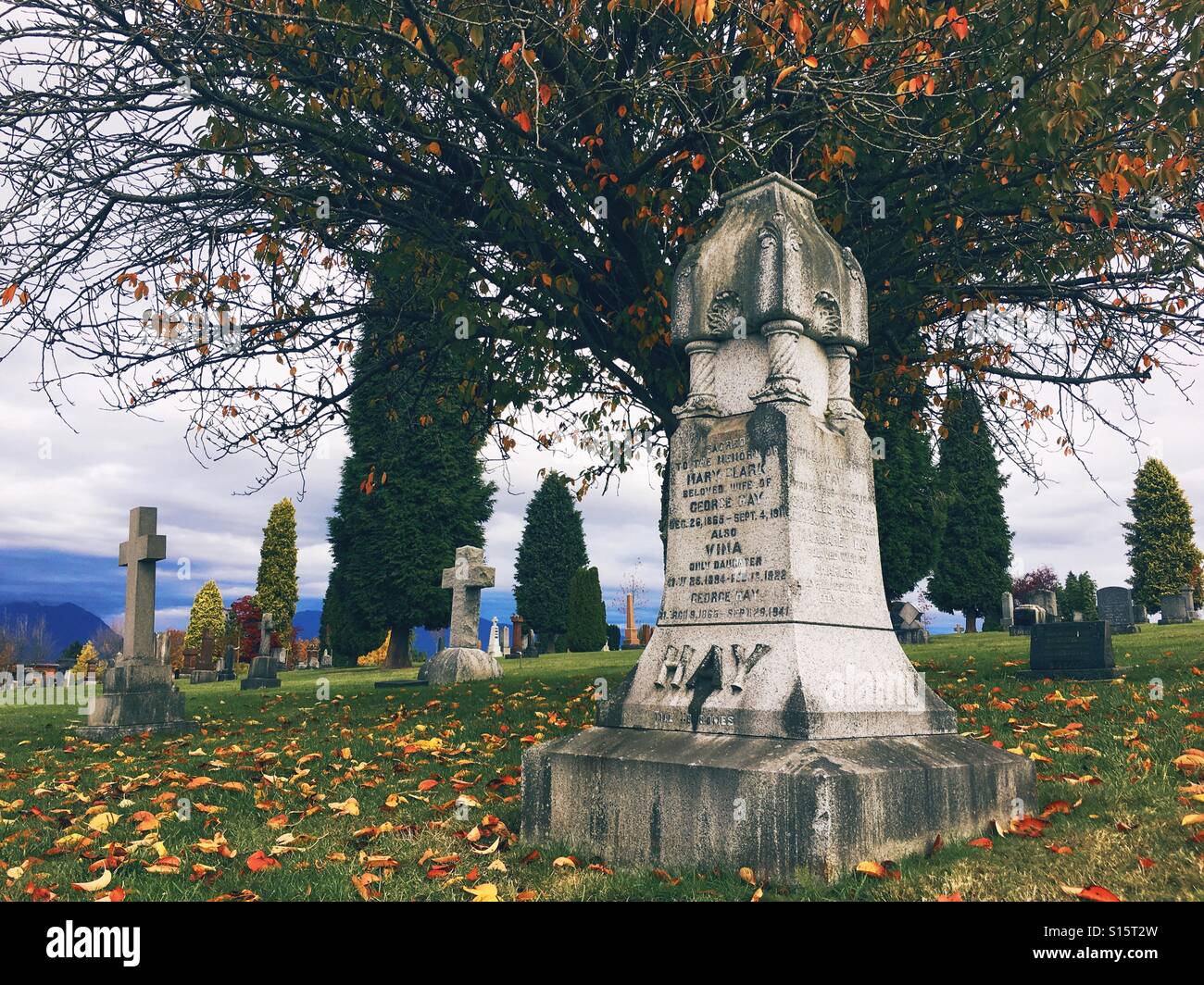 Headstone in autumn at Vancouver's old graveyard. Stock Photo