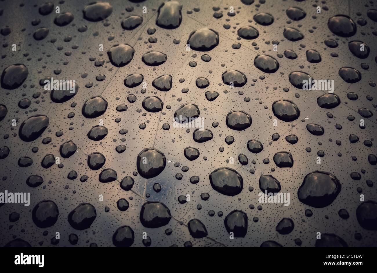 Water droplets on a dark surface Stock Photo - Alamy