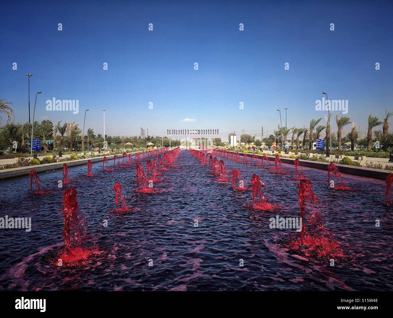 Red water fountain in front of Khomeini Mausoleum in Teheran, Iran