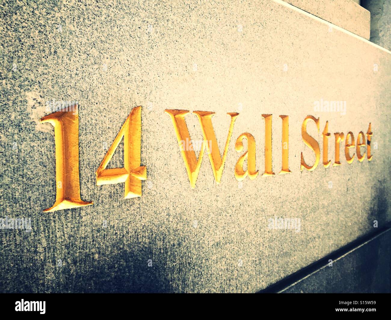 Gold etched lettering marking 14 Wall Street, financial district, NYC - Smartphone Captured Stock Image