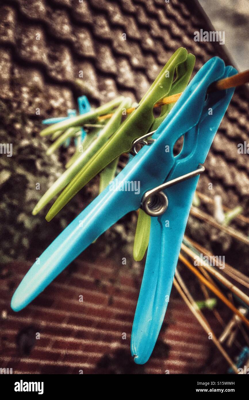 Wash day. Plastic clothes pegs on the washing line. - Smartphone Captured Stock Image
