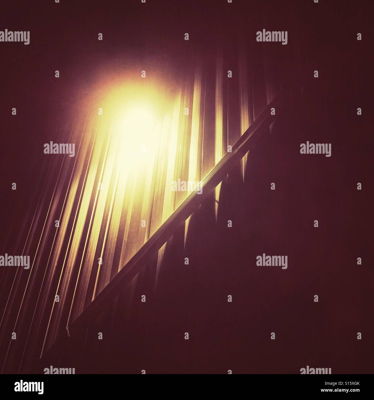 A light outside a commercial building at night. - Smartphone Captured Stock Image