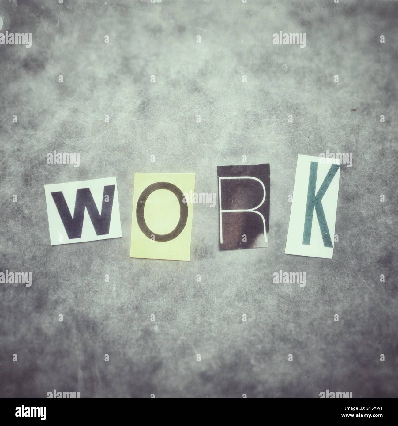 The word work written with newspaper cutout letters - Smartphone Captured Stock Image