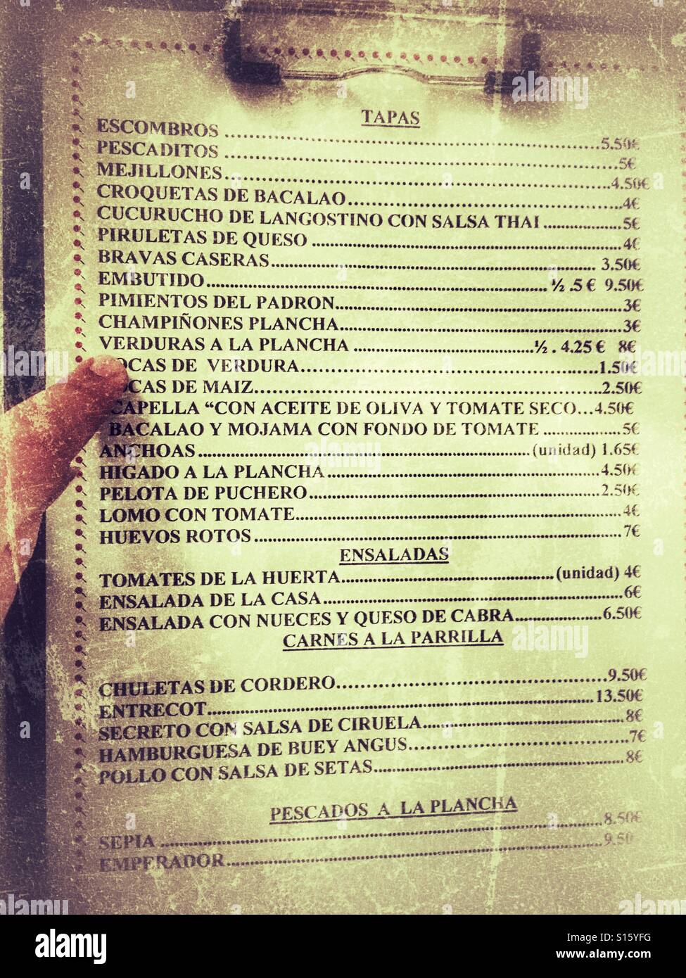 Looking at the menu in a Spanish tapas bar Stock Photo