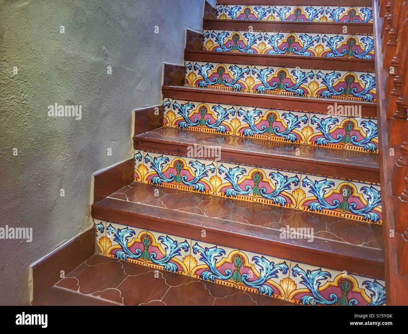 Tiled staircase, typical Spanish house interior. Hand painted, old tiles. - Smartphone Captured Stock Image