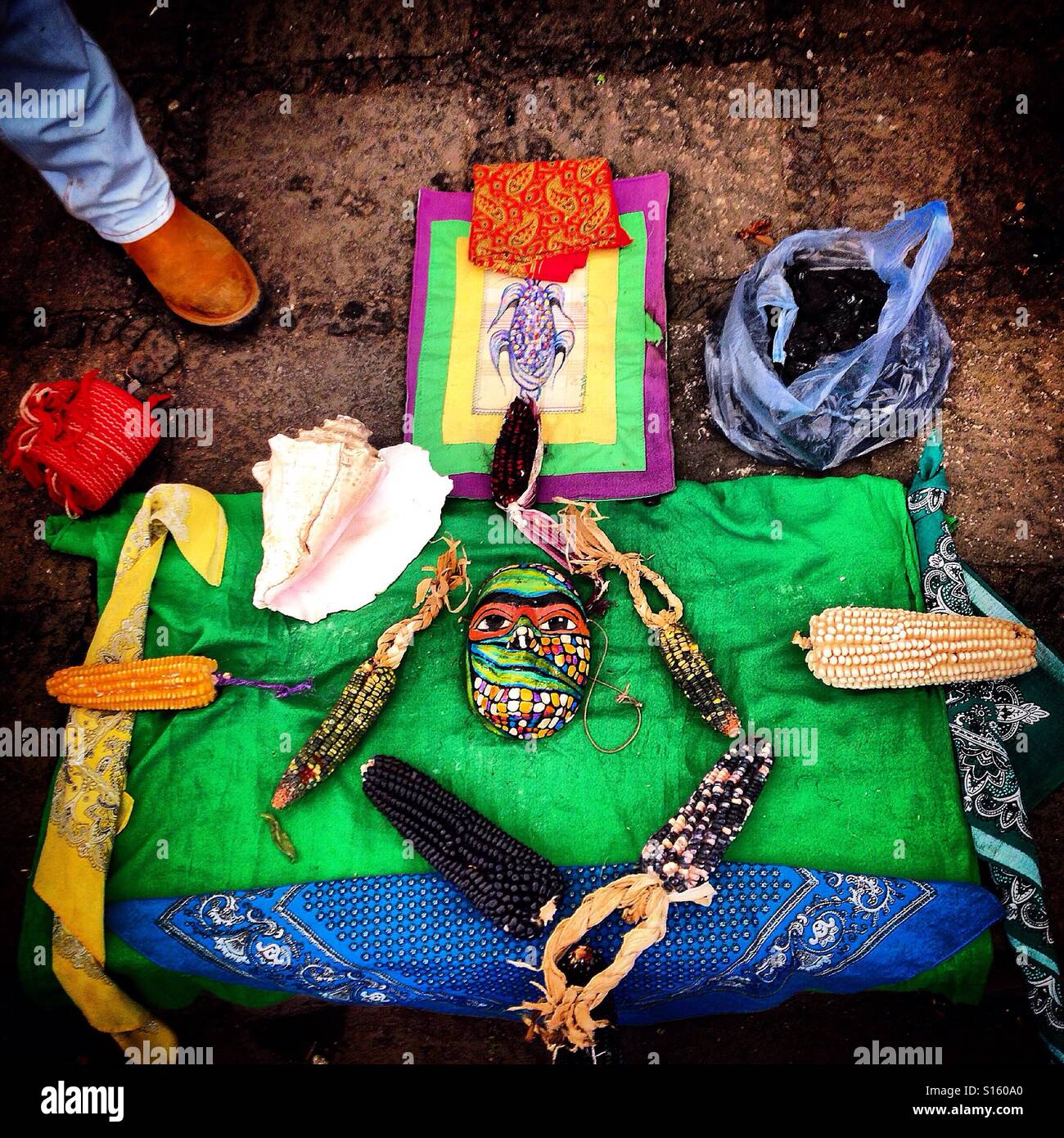 Colored native corn and a mask during a ceremony in Foro Tianguis Alternativo organic market in Mexico City, Mexico - Smartphone Captured Stock Image