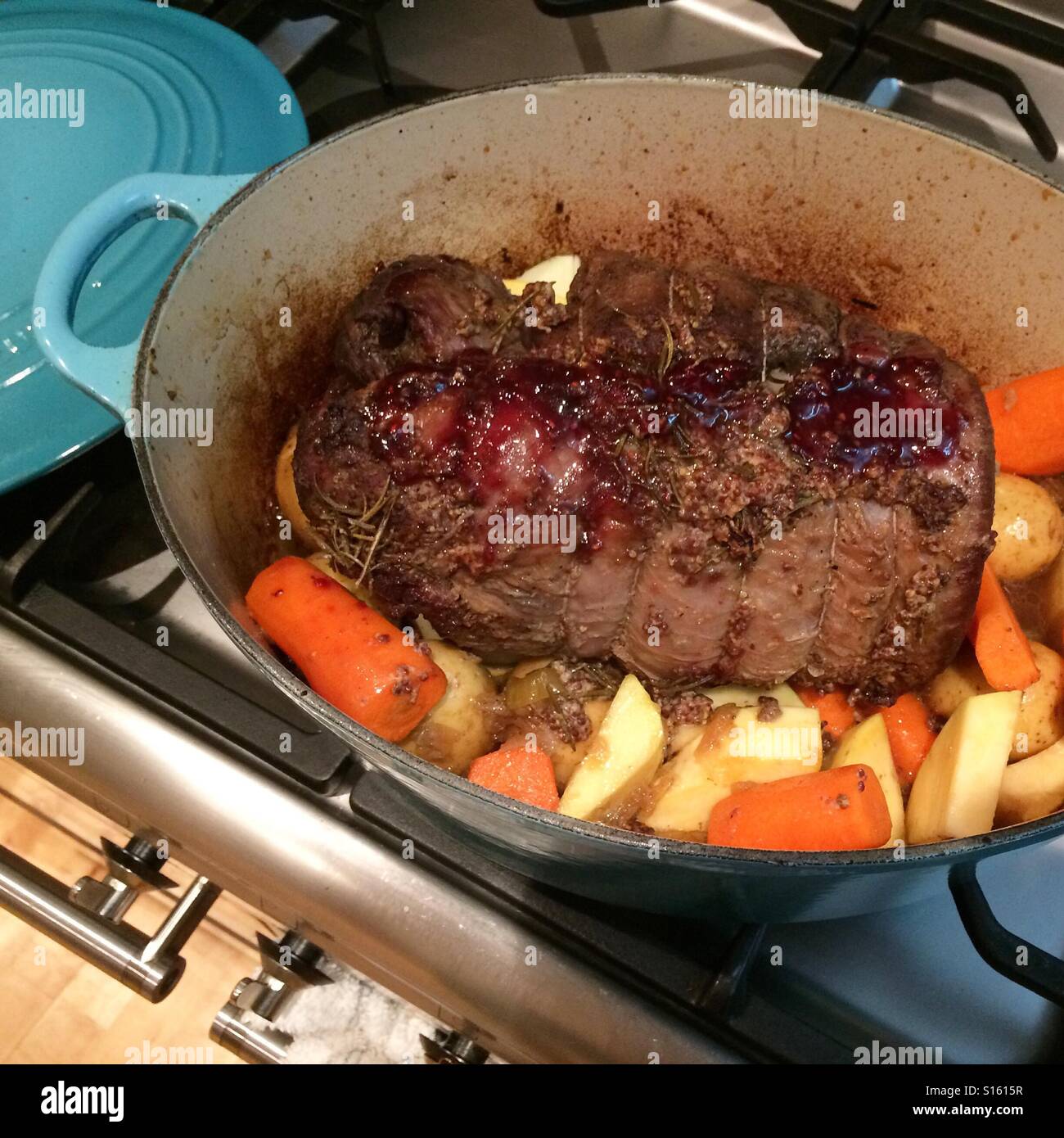 Sunday roast dinner. Slow cooked brisket. Vegetables. Carrots. Swede. Potatoes. Le crueset. - Smartphone Captured Stock Image