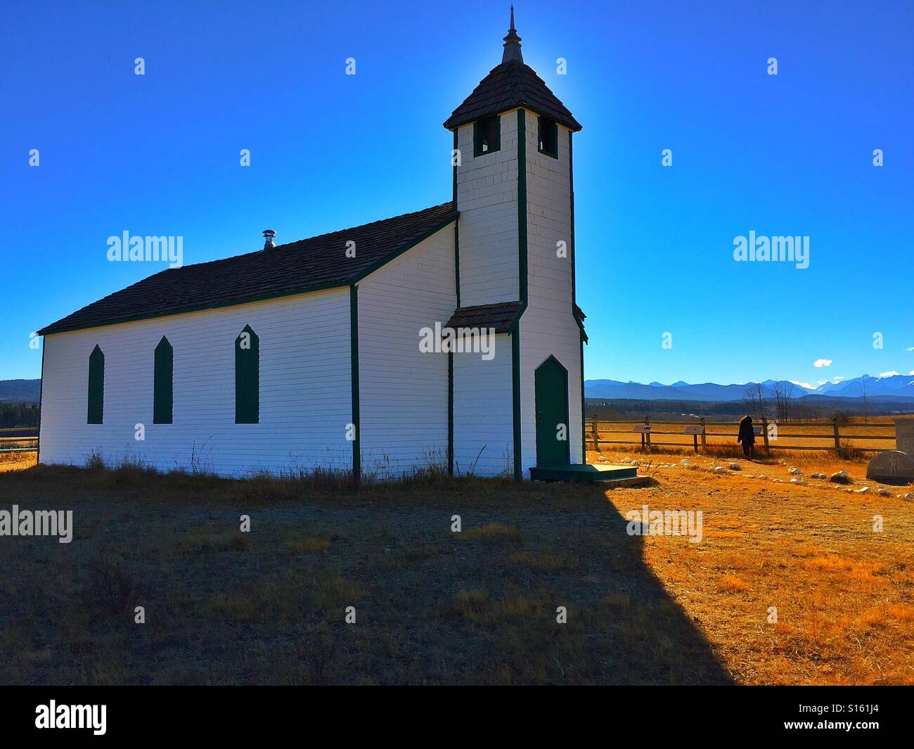 Little historical country church with Canadian Rockies, McDougall Memorial United Church - Smartphone Captured Stock Image