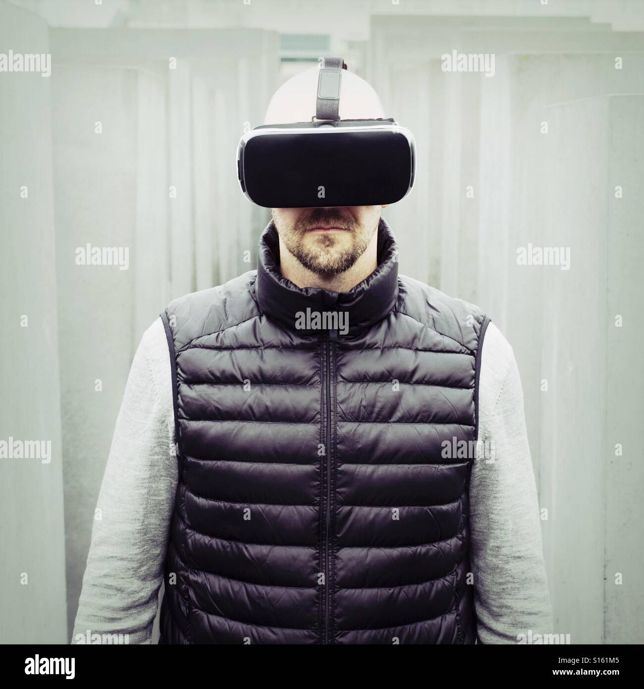 Man wearing VR virtual reality headset - Smartphone Captured Stock Image