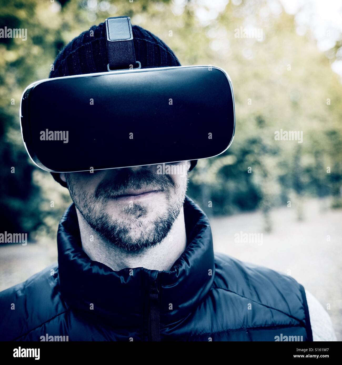 Man wearing VR virtual reality headset - Smartphone Captured Stock Image