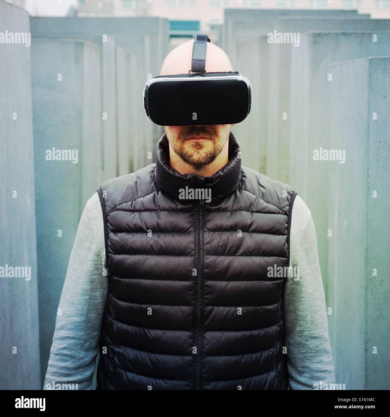 Man wearing VR virtual reality headset - Smartphone Captured Stock Image