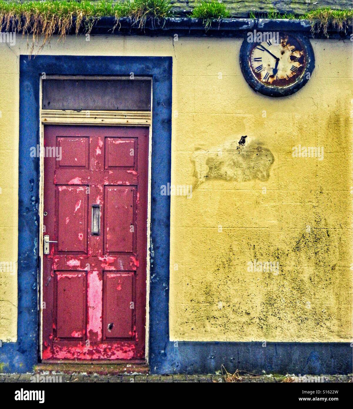Old door and wall clock, Scotland, UK - Smartphone Captured Stock Image