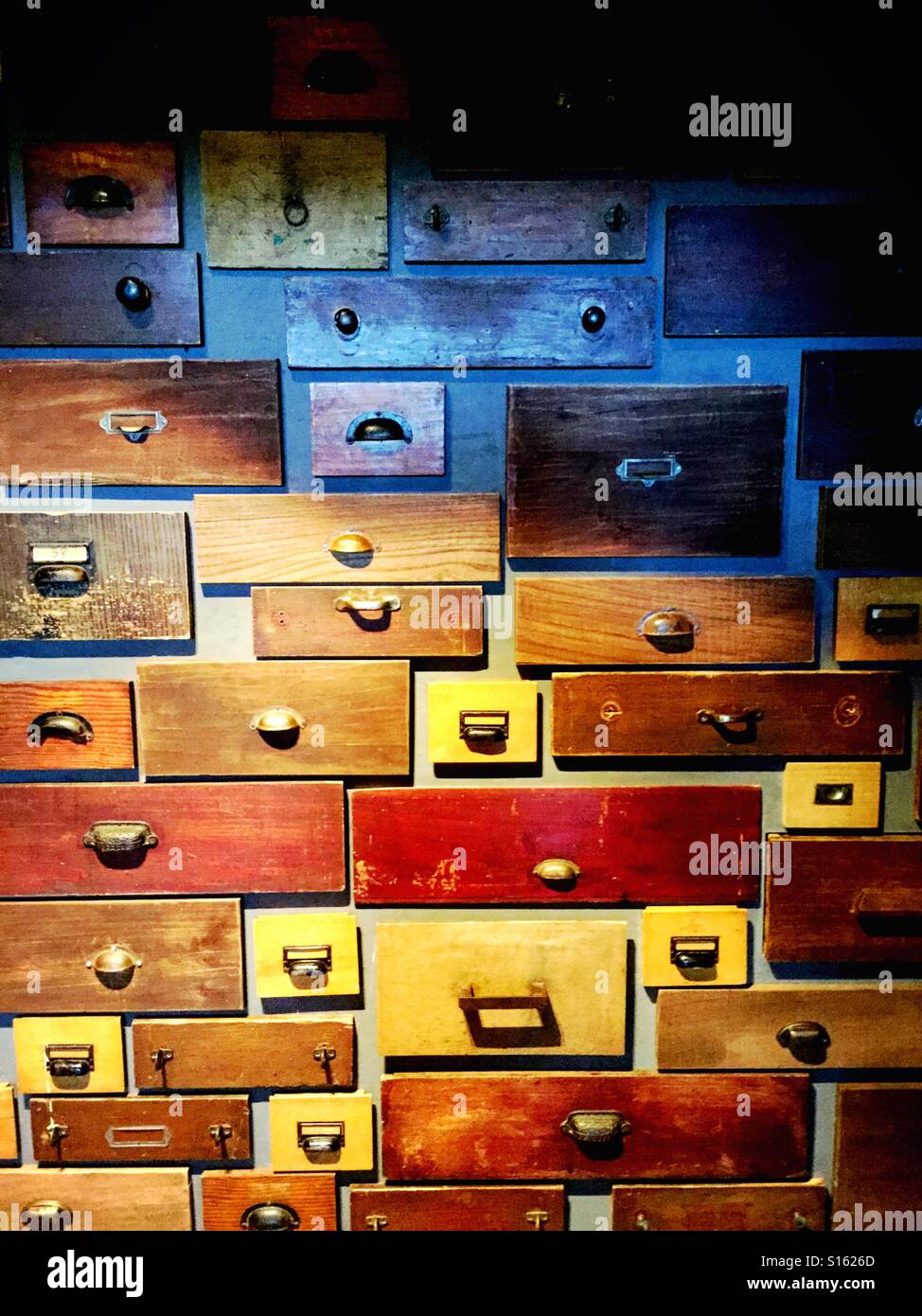 Old wooden drawers mounted on a wall - Smartphone Captured Stock Image