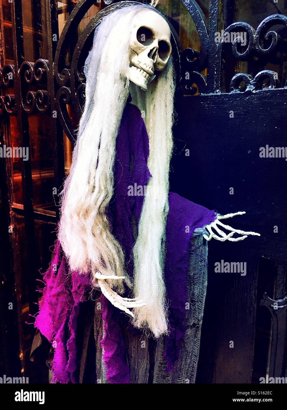 Halloween Display on wrought iron gate - Smartphone Captured Stock Image